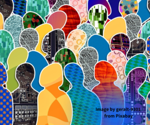 Paper cutouts of people in multiple patterns and colours all lapped over each other